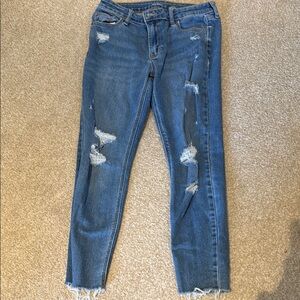 Mid Rise Blue Cropped Ankle Jeans with Distressed Style